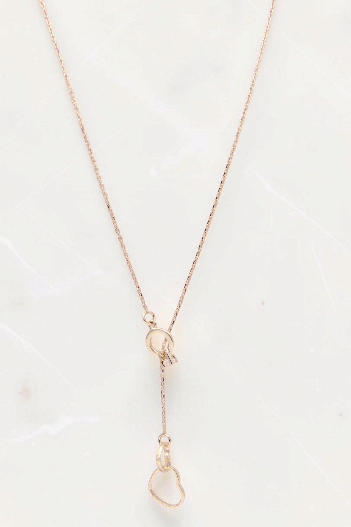 Zafrah 14k solid gold cable chain necklace featuring a delicate double heart drop pendant on an 18-inch chain.