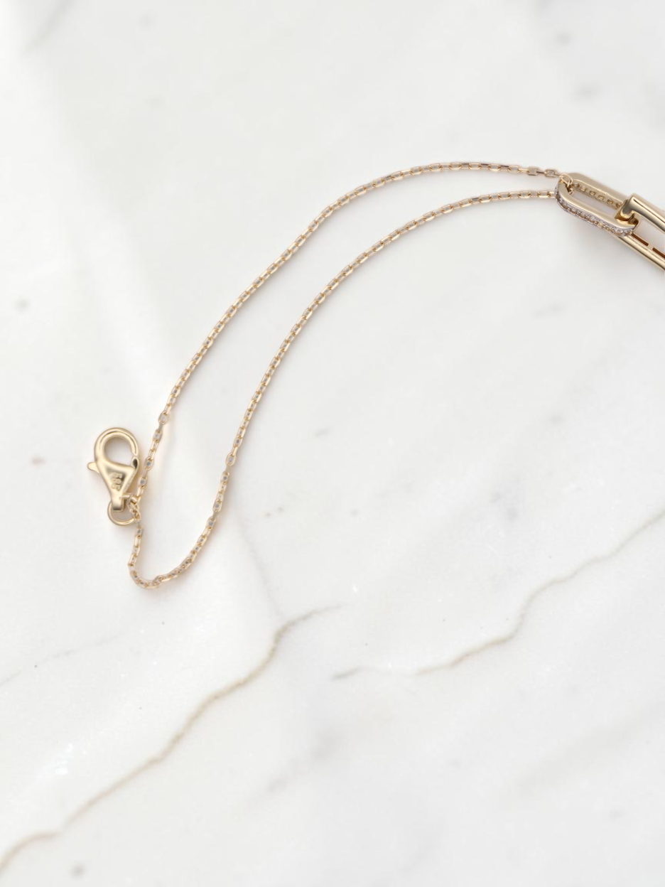 Zafrah 14k solid gold double cable bracelet featuring rectangle and oval links with delicate diamond accents.