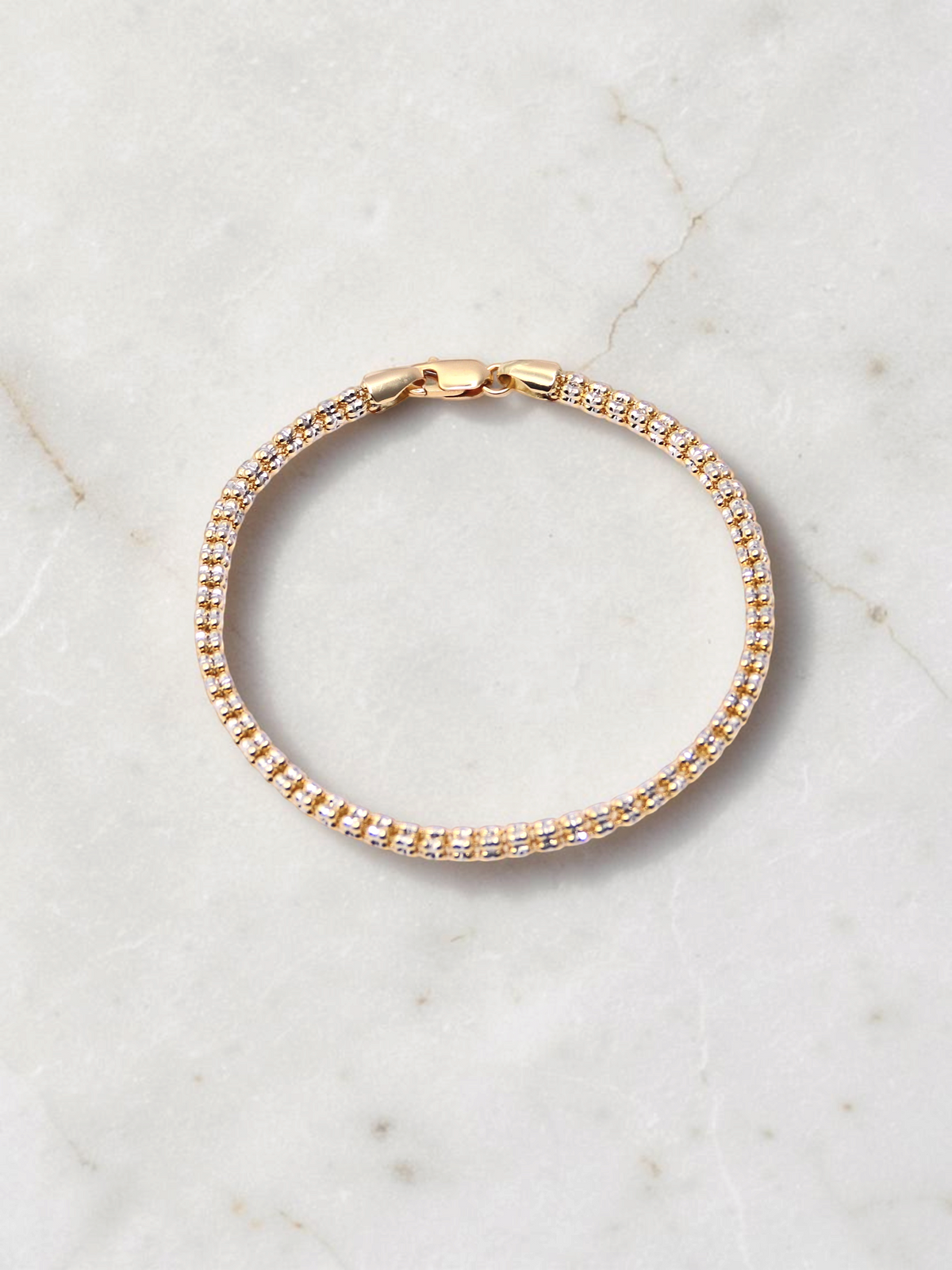 Zafrah 14K two-tone gold diamond cut ice link bracelet, 7.5 inch length, featuring a secure lobster clasp.