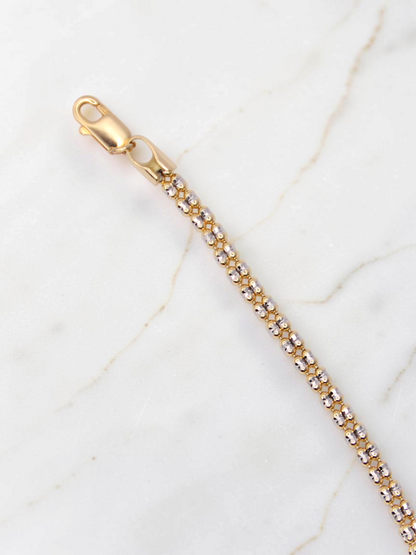 Zafrah 14K two-tone gold diamond cut ice link bracelet with a lobster clasp, 7.5 inches long.
