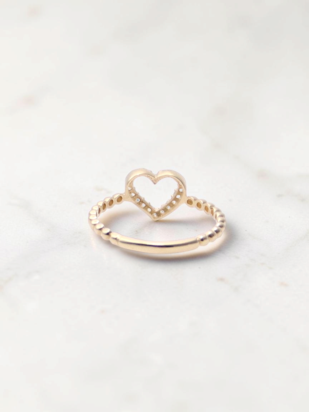 Zafrah 14k yellow gold heart bead ring featuring sparkling CZ stones on a delicate textured band
