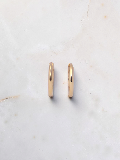 Zafrah 14k yellow gold hoop earrings with a secure snap closure, perfect for everyday wear.