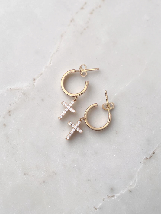 Zafrah 14k yellow gold hoop stud earrings featuring delicate cross pendants with sparkling cubic zirconia stones.