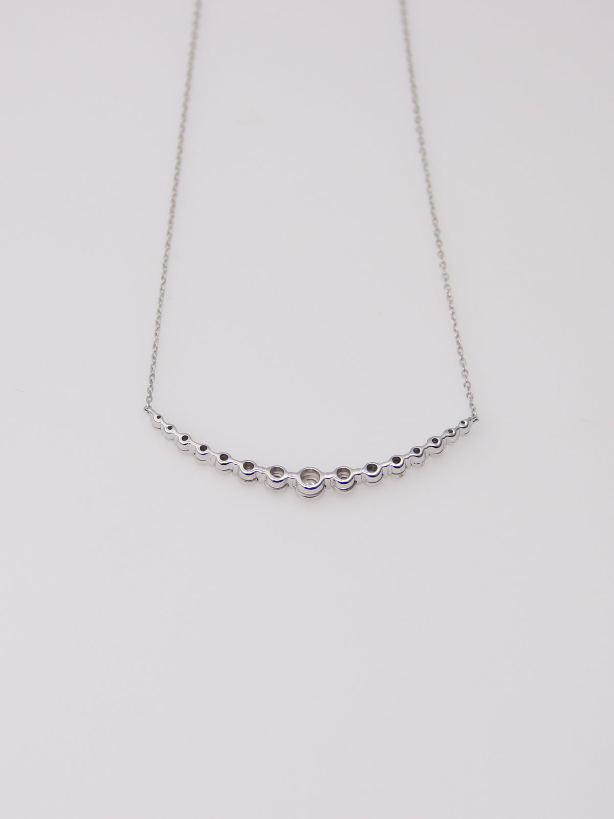10K White Gold Curved Diamond Pendant Necklace