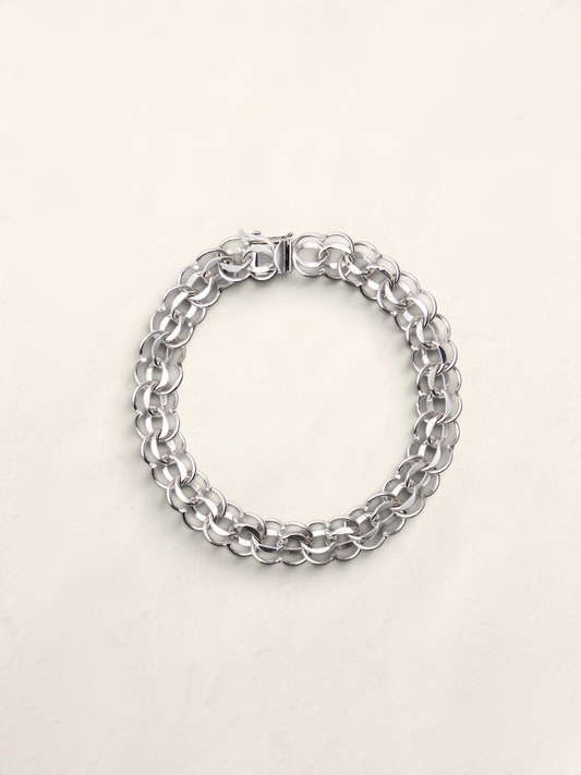 Zafrah 14K white gold circle link charm bracelet with a secure clasp, 7.25 inches long.