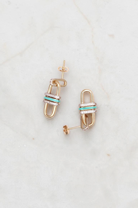 Zafrah 14k gold link drop earrings featuring turquoise enamel accents and clear round CZ stones on a marble surface.