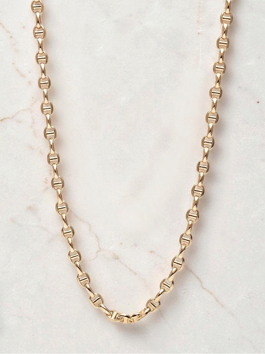 Zafrah 14k yellow gold mariners link chain necklace, 4.5mm wide and 21.5 inches long on a marble background.