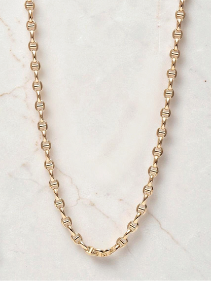 Zafrah 14k yellow gold mariners link chain necklace, 4.5mm wide and 21.5 inches long on a marble background.