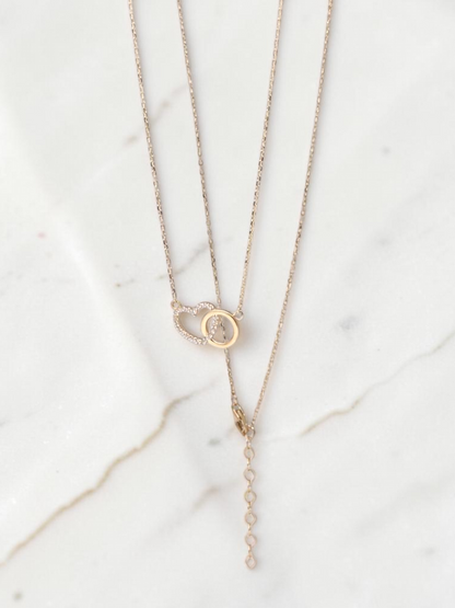 Zafrah interlocking heart necklace in 10k yellow gold with sparkling CZ stones and adjustable chain