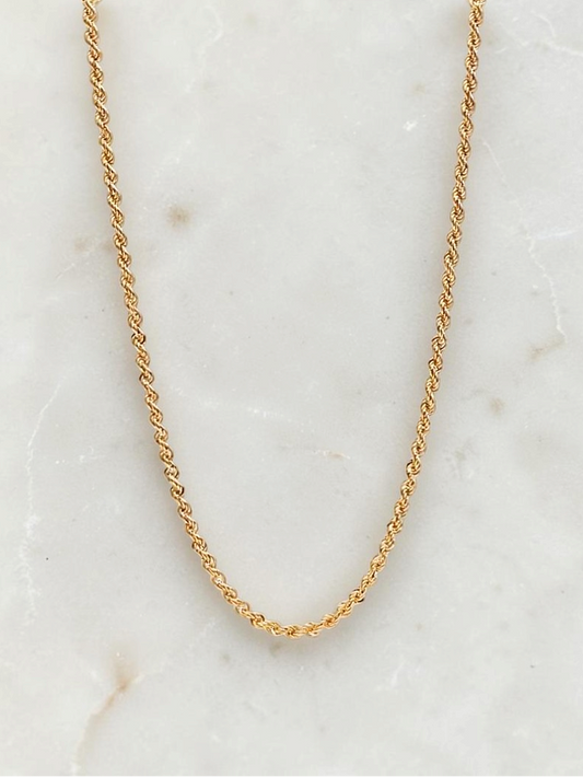 Zafrah 14k yellow gold 3mm rope chain necklace, 21.5 inches long, displayed on a white marble surface.