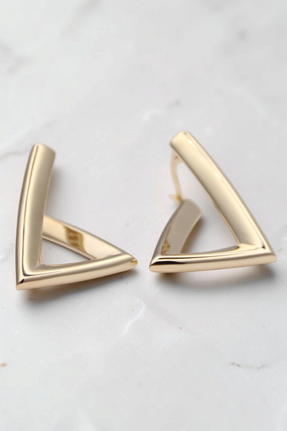 Zafrah minimalist triangular hoop earrings crafted in polished 14k solid gold with a modern geometric design.