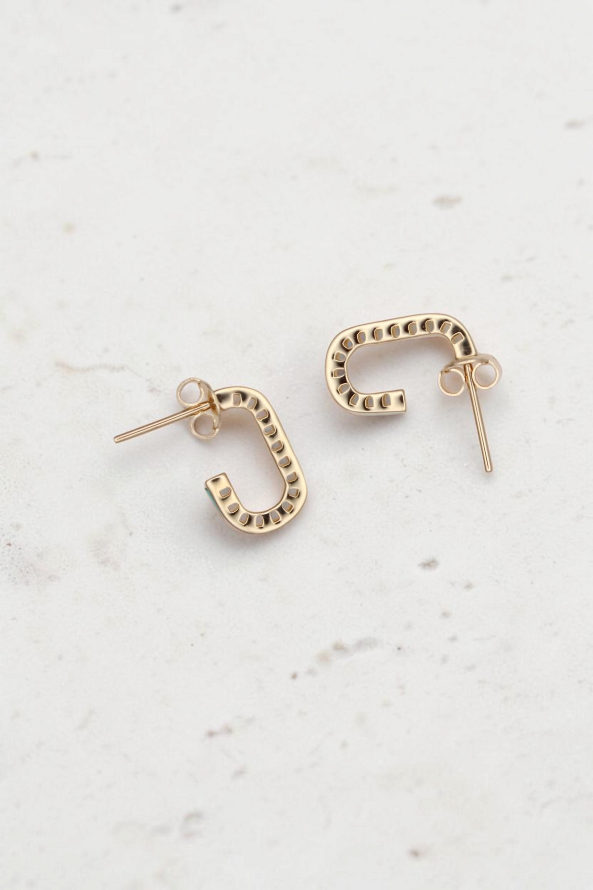 Zafrah 14k solid gold short rectangular stud earrings with turquoise accents on a neutral background.