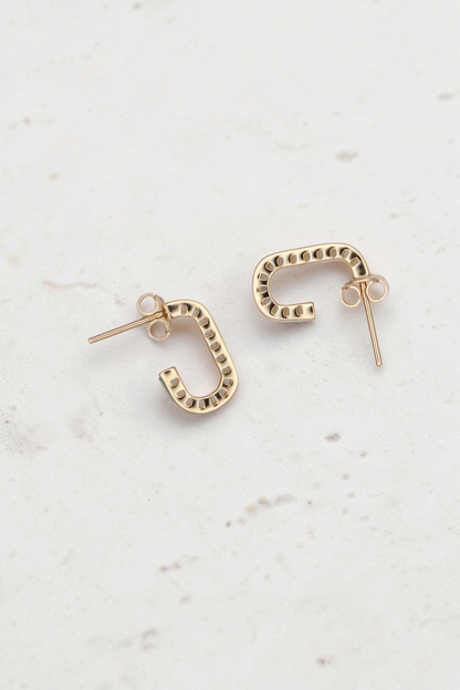 Zafrah 14k solid gold short rectangular stud earrings with turquoise accents on a neutral background.
