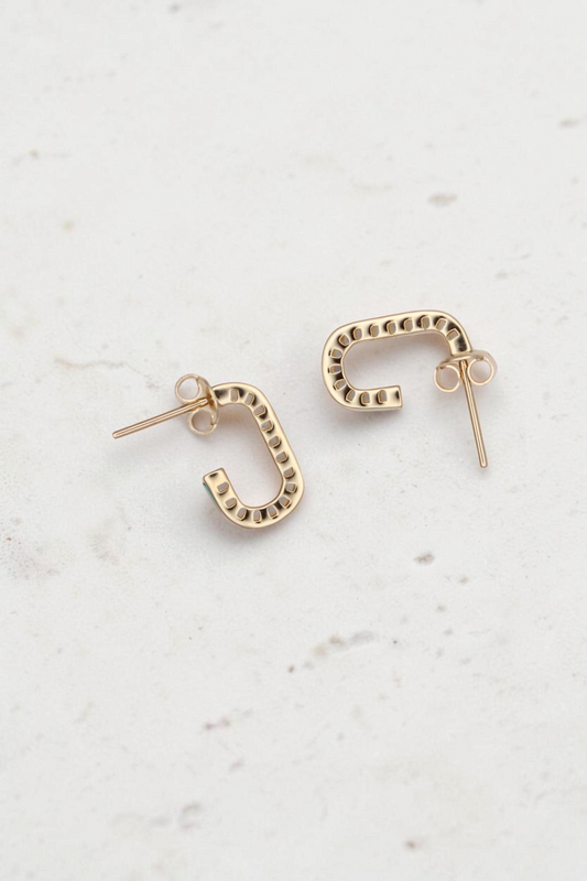 Zafrah 14k solid gold short rectangular stud earrings with turquoise accents on a neutral background.