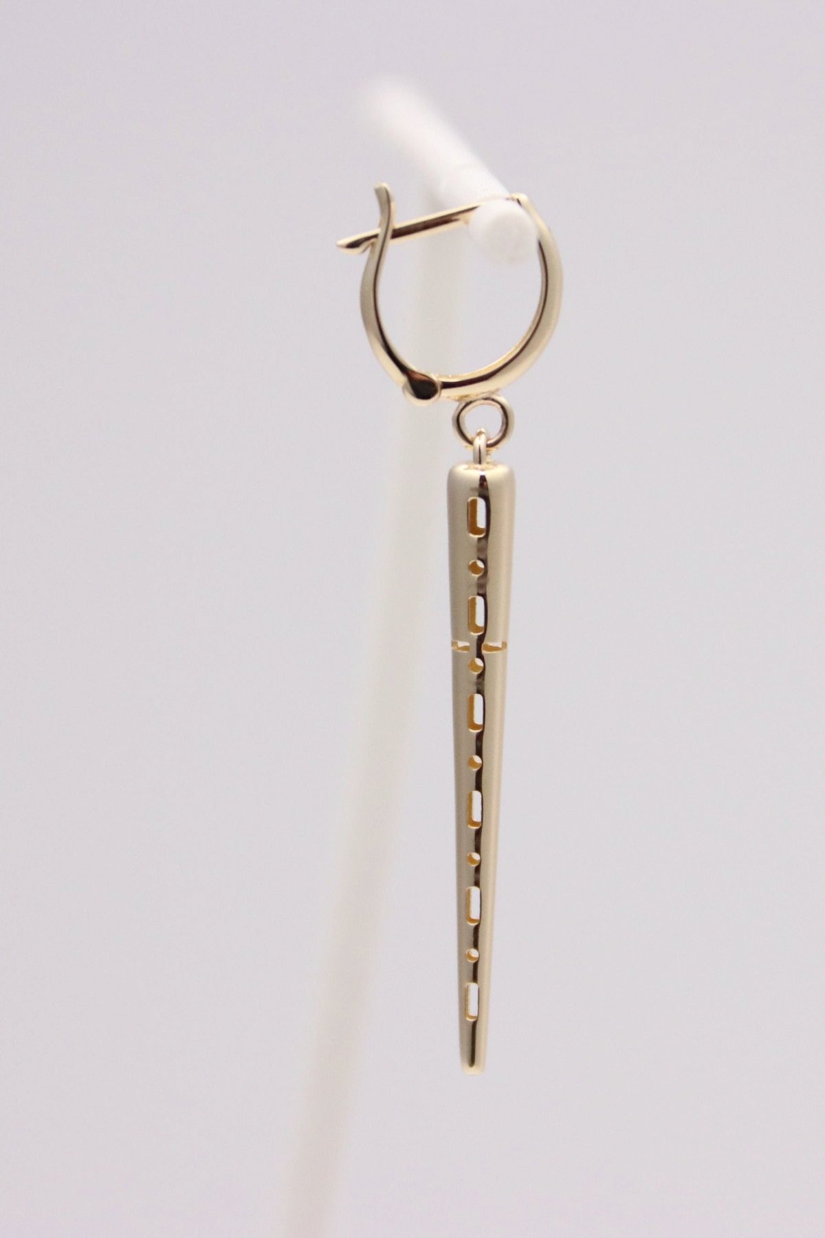 Zafrah 14k solid gold drop hoop earrings featuring a polished spiked charm with cut-out detailing.