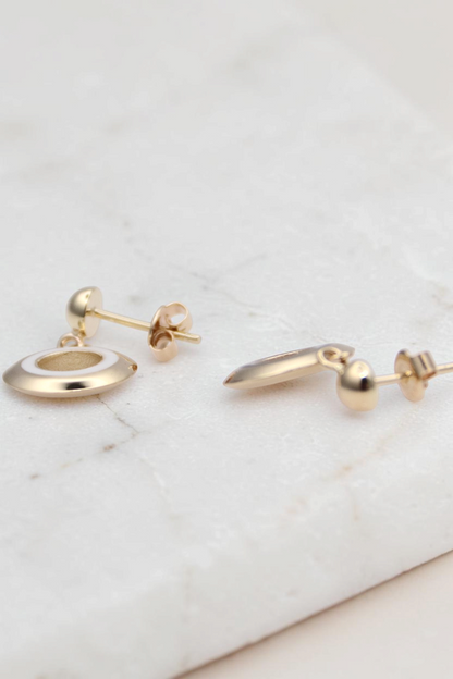 Zafrah 14k solid gold circle earrings featuring black and white enamel inlay in a classic stud design.