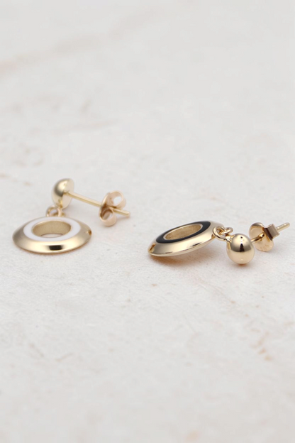 Zafrah 14k solid gold circle stud earrings featuring black and white enamel inlay in a classic, minimalist style.