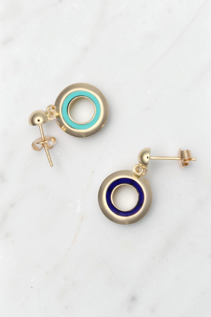 Zafrah 14k solid gold circle earrings featuring one turquoise and one blue enamel inlay, classic stud design.