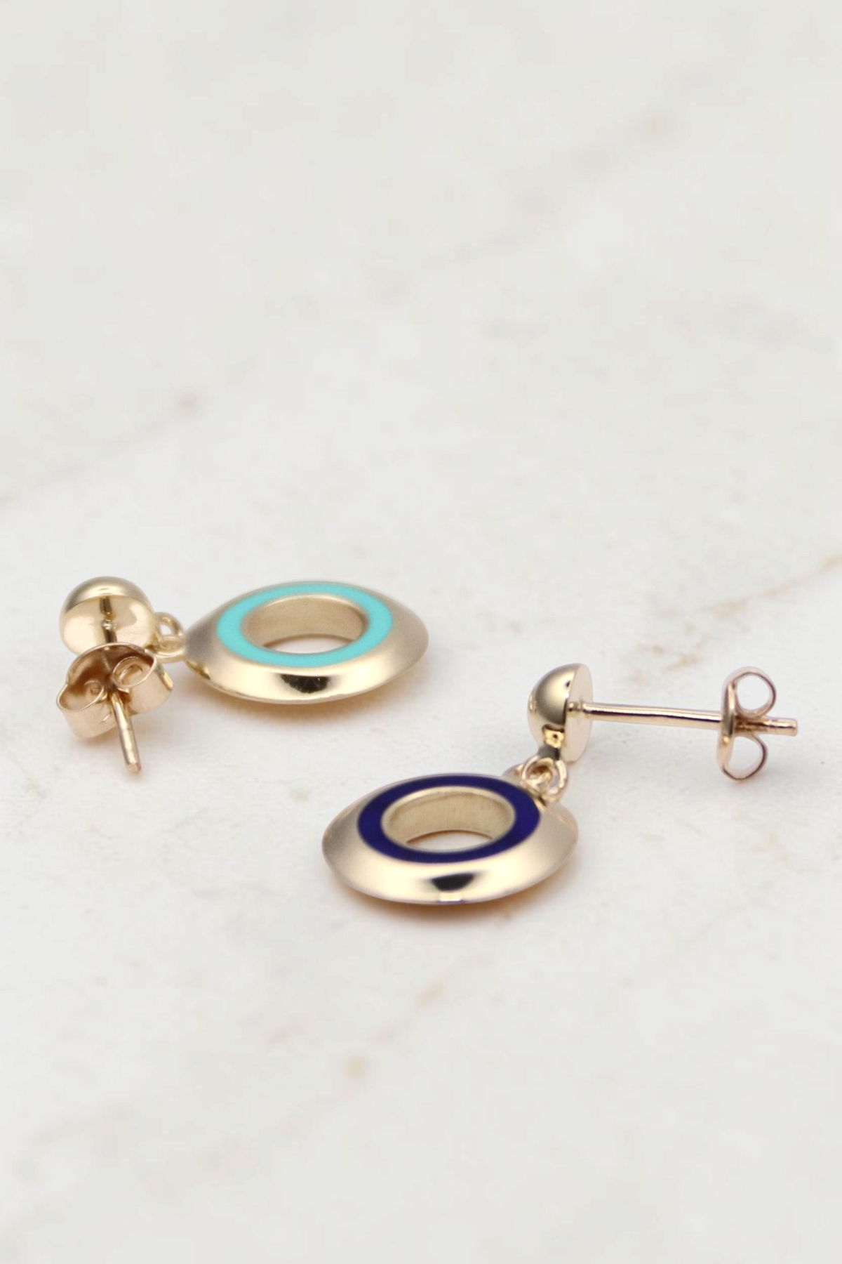 Zafrah 14k gold circle earrings featuring turquoise and blue enamel inlay in a classic drop style