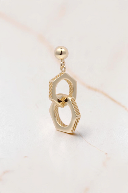 Zafrah 14k solid gold double hexagon drop earrings with industrial-inspired textured detailing