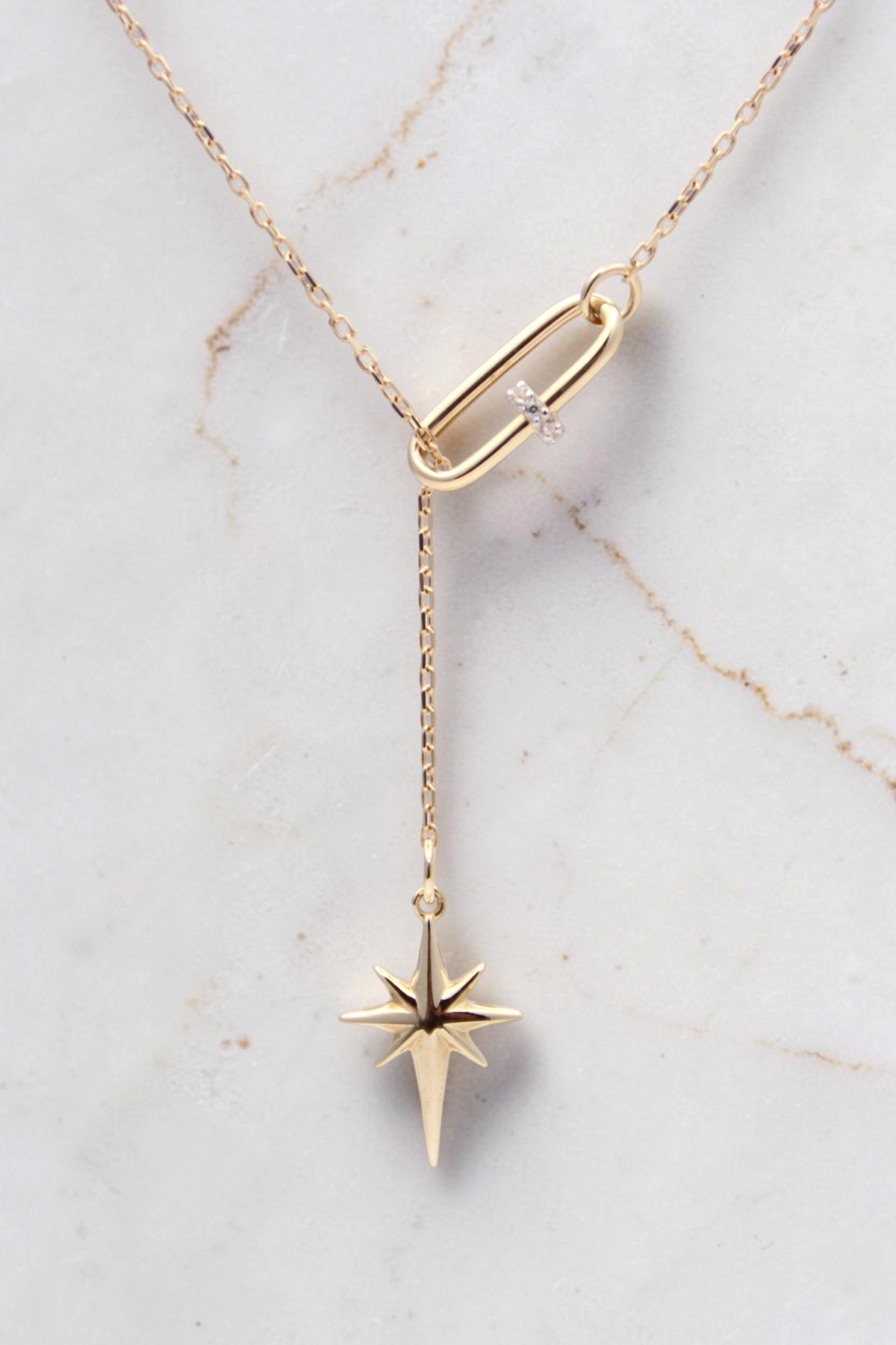 Zafrah 14k solid gold 18-inch necklace featuring a paper clip link and a dangling North Star pendant
