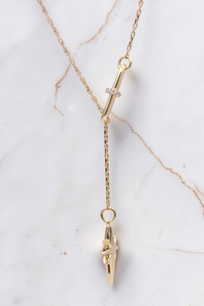 Zafrah 14k solid gold necklace featuring a paper clip link, diamond accent, and a north star pendant charm.