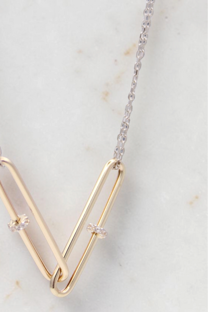 Zafrah 14kt gold double paperclip necklace with white gold cable chain and two linked paperclip-shaped pendants.