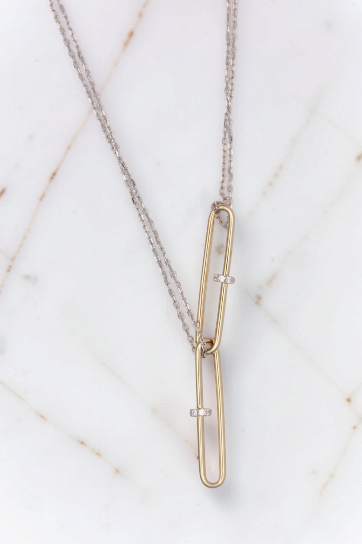Zafrah 14kt gold double paperclip necklace featuring two yellow gold links on a white gold cable chain