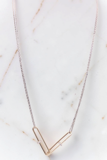 Zafrah 14kt white gold double cable chain necklace with two interlocking yellow gold paperclip-shaped links.