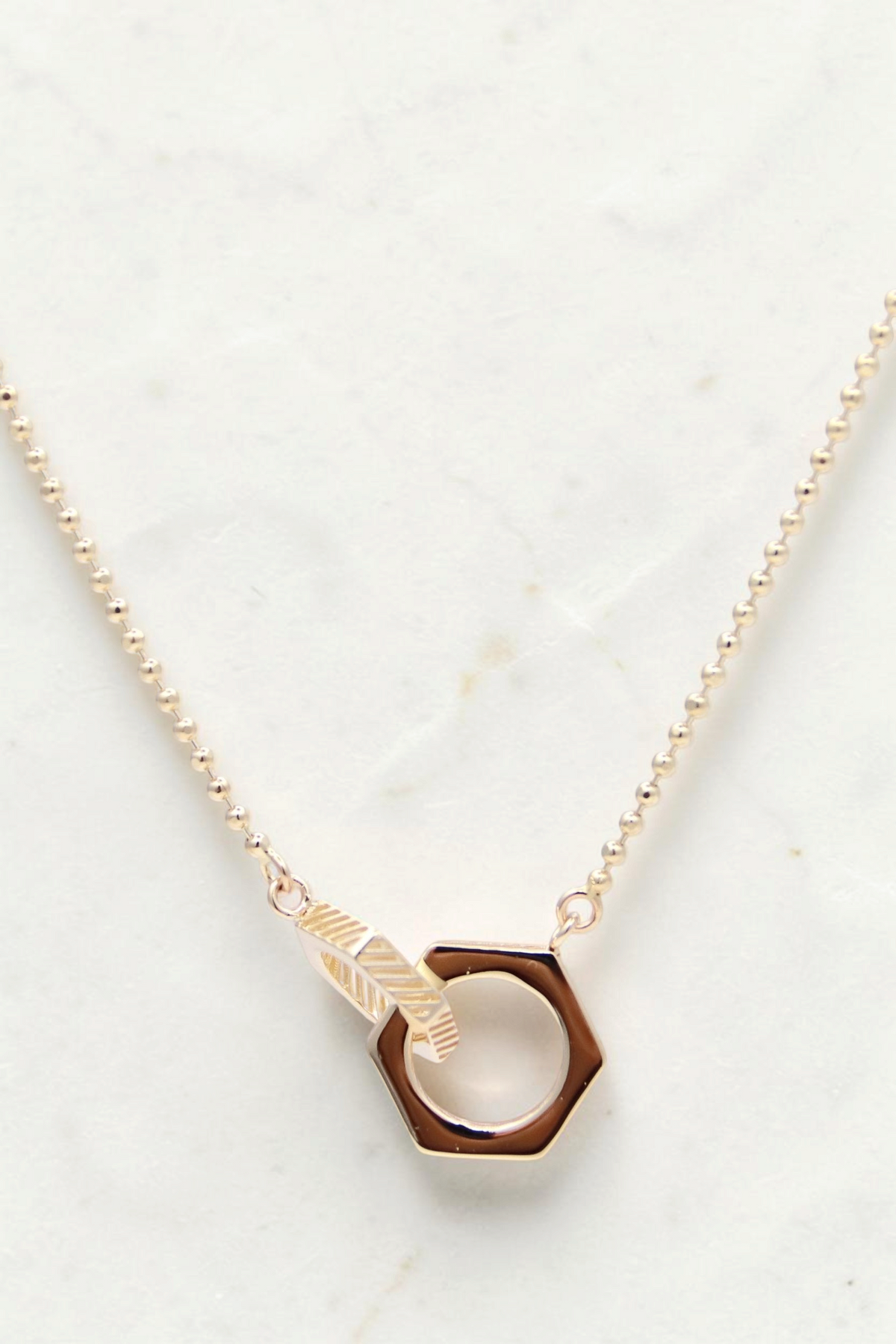 Zafrah 14k solid gold Hexagon Duo bead necklace featuring two interlocking geometric charms on a delicate chain.