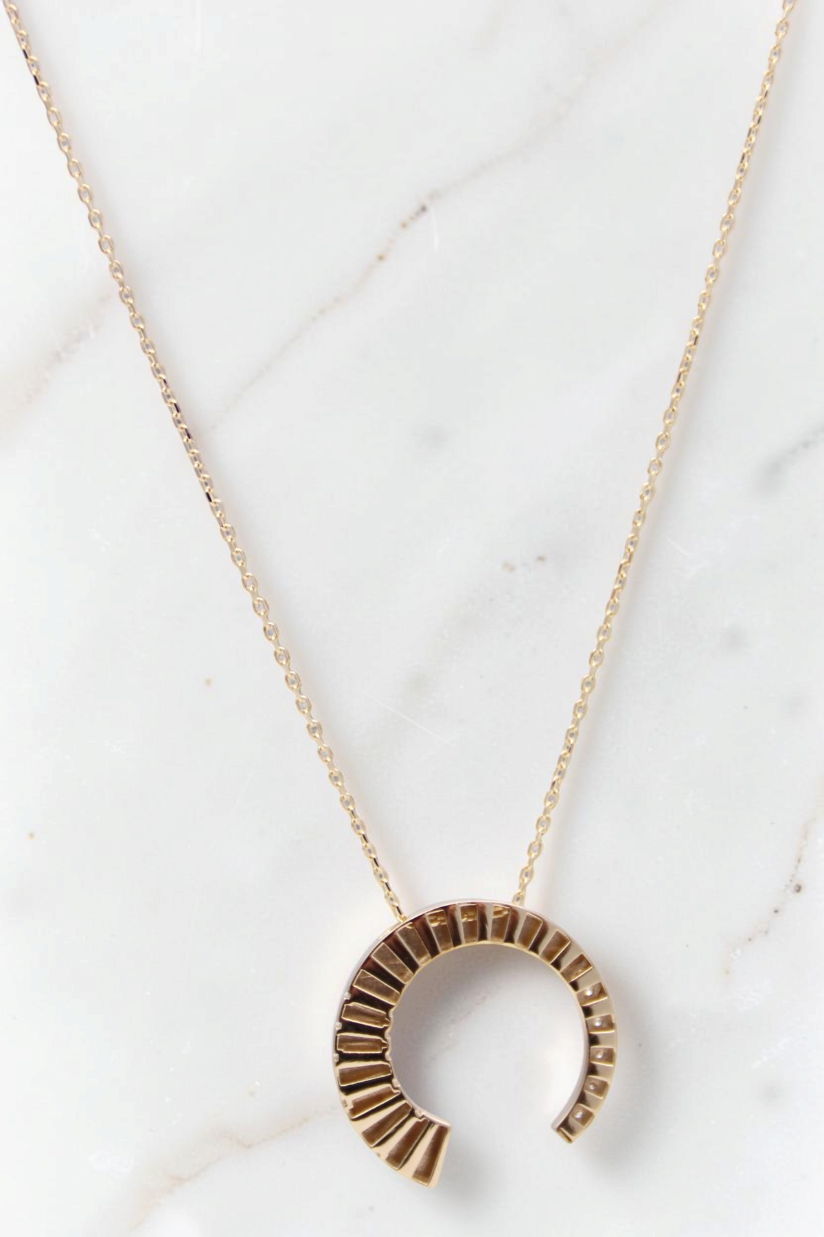 Zafrah 14k solid gold crescent moon pendant necklace with sparkling CZ stones on a delicate adjustable chain