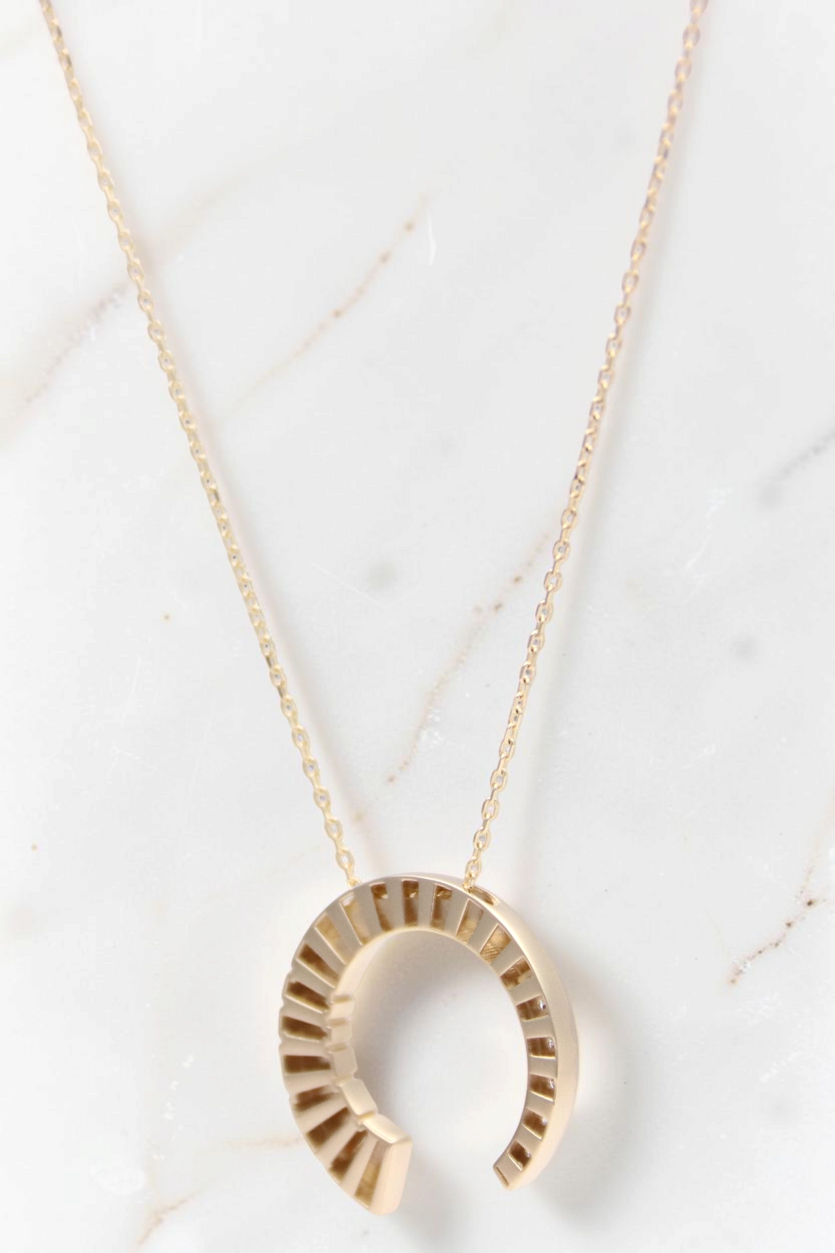Zafrah 14k solid gold crescent moon pendant necklace with round CZ stones on a delicate adjustable chain