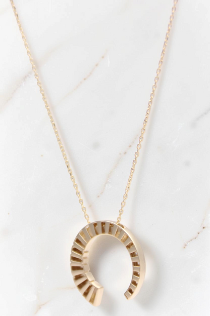 Zafrah 14k solid gold crescent moon pendant necklace with round CZ stones on a delicate adjustable chain
