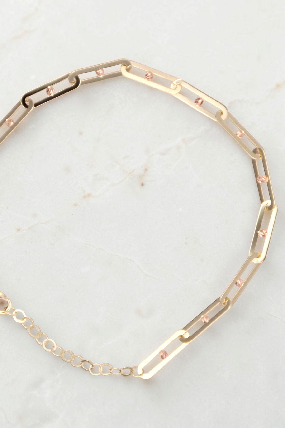 Zafrah 14k solid gold paperclip link bracelet with adjustable chain and small rose gold bead accents