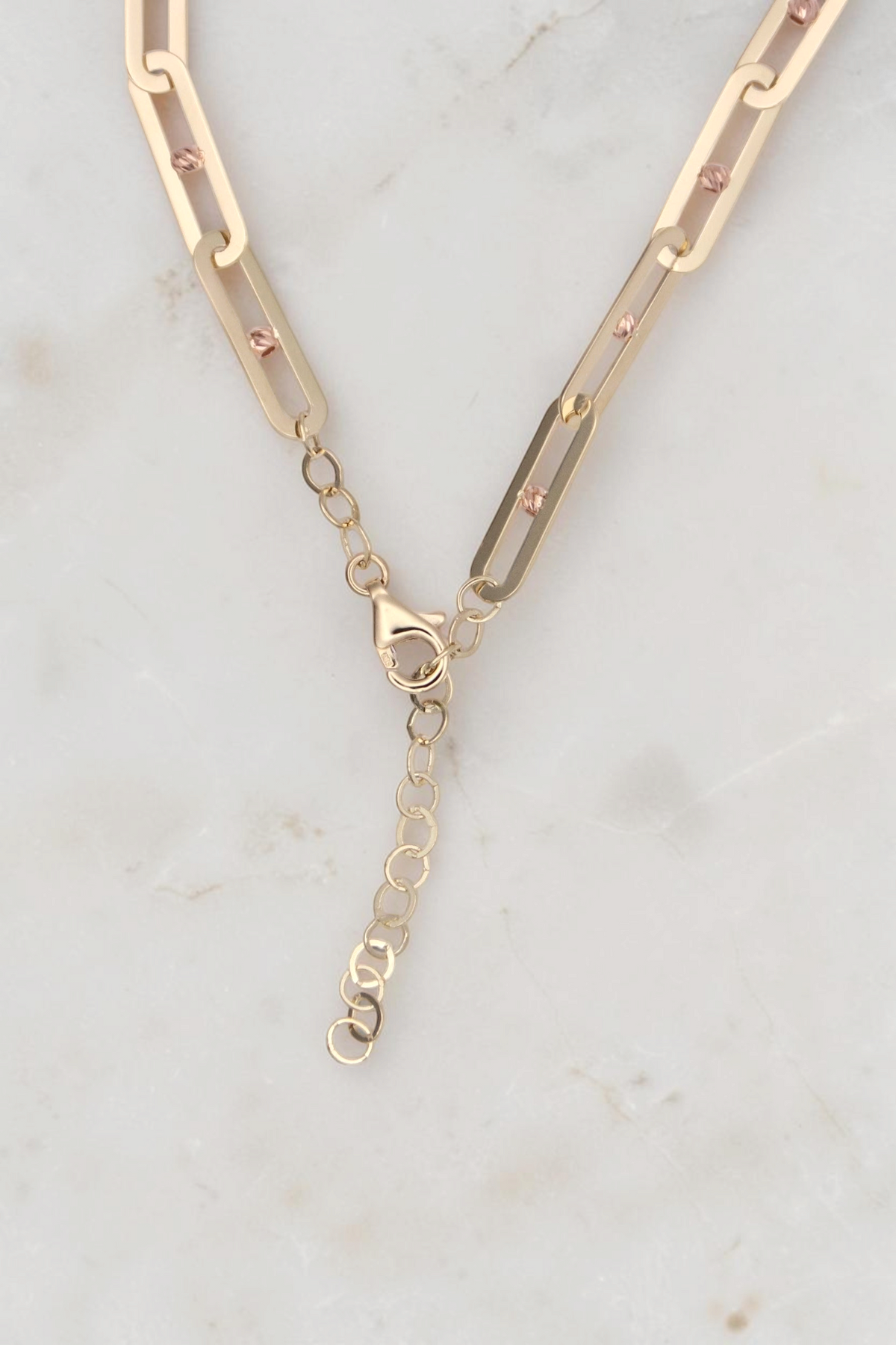 Zafrah 14k solid gold paperclip link bracelet with adjustable chain and rose gold bead accents