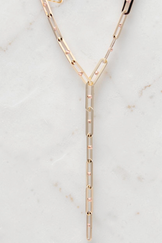 Zafrah 14k solid gold Y necklace featuring elongated paperclip links with small textured gold bead accents.