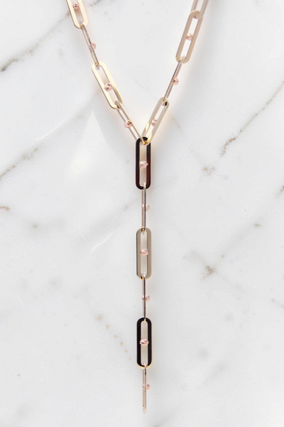 Zafrah 14k solid gold Y-shaped necklace featuring elongated paperclip links with delicate textured gold bead accents.