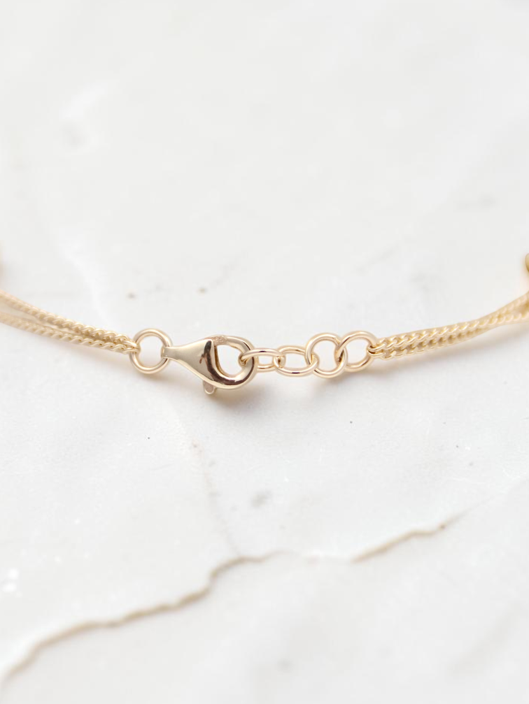 Zafrah 14k solid gold curb chain bracelet featuring a secure lobster clasp and delicate round link detail