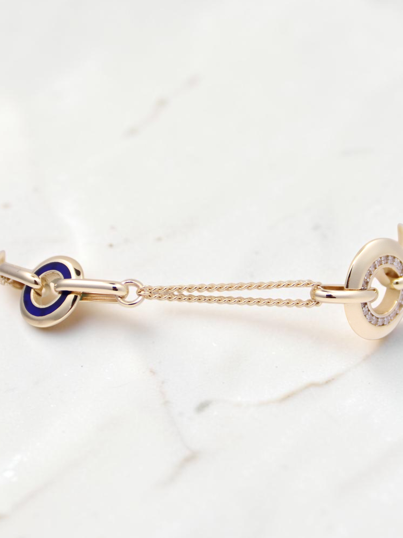 Zafrah 14k solid gold curb chain bracelet featuring blue enamel and CZ stone-encrusted round and oval links.