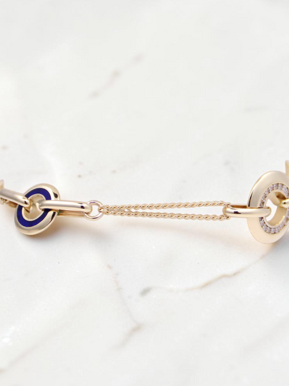 Zafrah 14k solid gold curb chain bracelet featuring blue enamel and CZ stone-encrusted round and oval links.