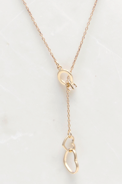 Zafrah 14k solid gold cable necklace featuring a double heart drop pendant and a delicate lariat style design
