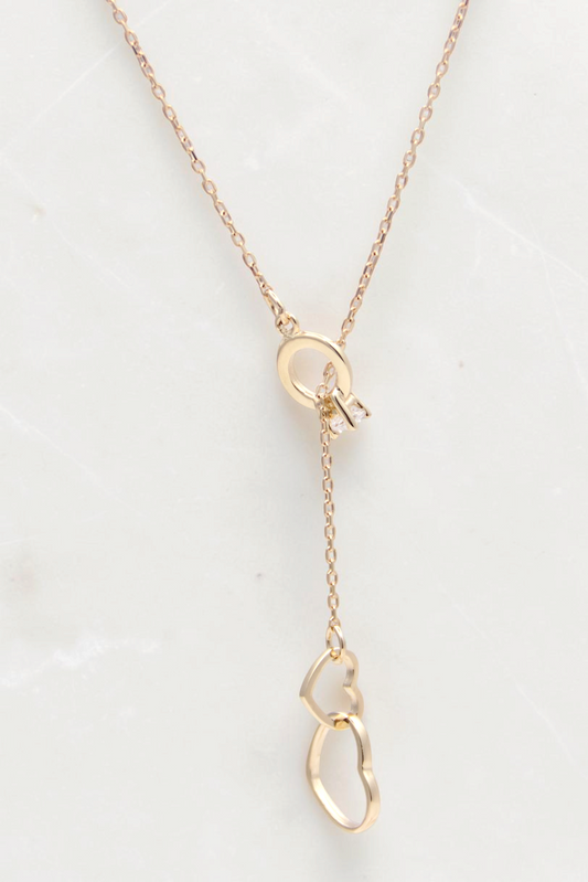 Zafrah 14k solid gold cable necklace featuring a double heart drop pendant and a delicate lariat style design