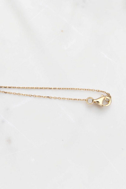 Zafrah 14k solid gold cable chain necklace with a lobster clasp closure, 18 inches long.