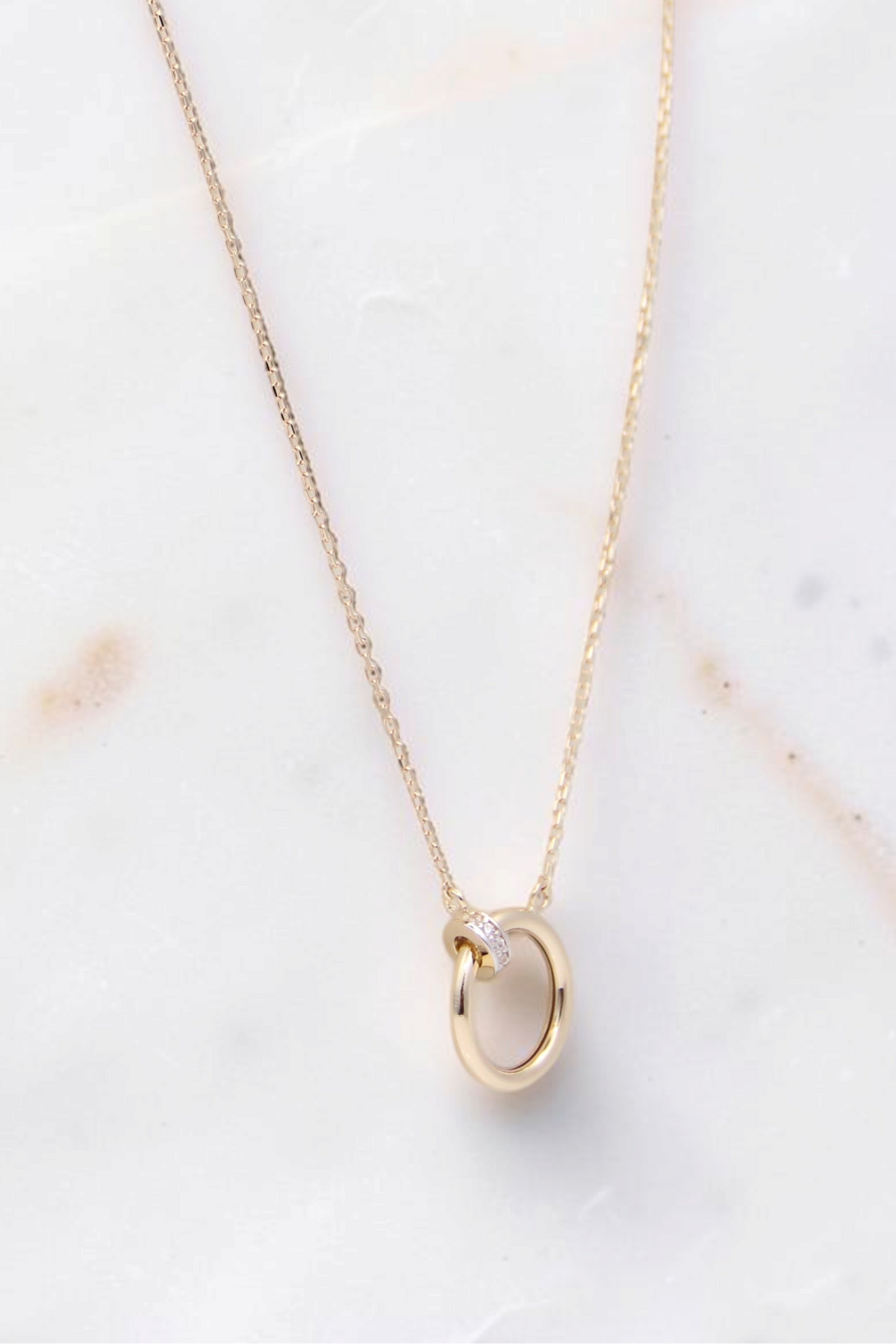 Zafrah 14k yellow gold ring pendant necklace on an 18-inch cable chain with a delicate diamond accent