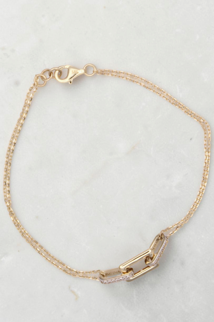 Zafrah 14k solid gold double cable bracelet featuring rectangle and oval links with delicate diamond accents.