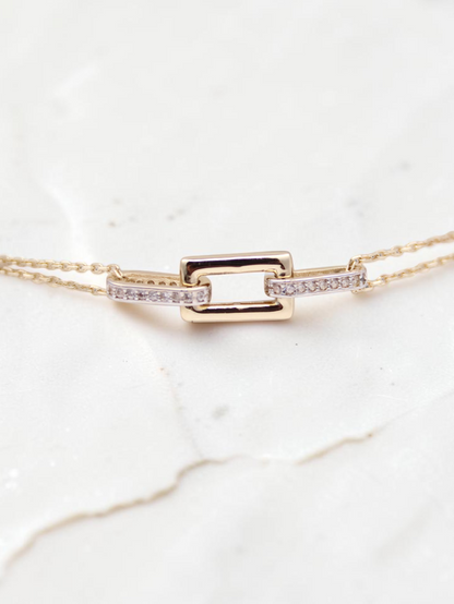 Zafrah 14k solid gold double cable bracelet featuring a central rectangle and oval link design with diamond accents.