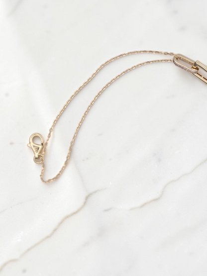 Zafrah 14k solid gold double cable bracelet featuring rectangle and oval links with delicate diamond accents.