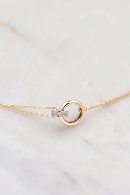 Zafrah 14k solid gold double cable bracelet featuring a central round link with small diamond accents