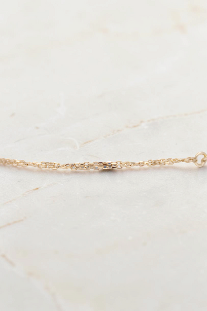 Zafrah 7-inch double cable chain bracelet crafted in 14k solid gold with delicate round links.