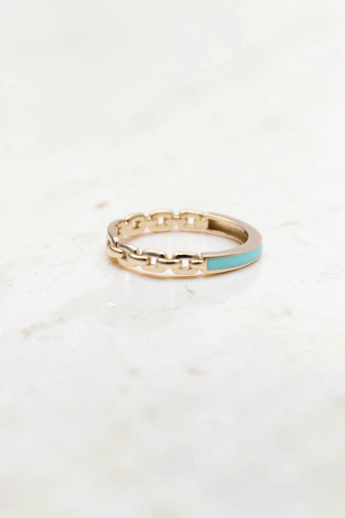 Zafrah 14k solid gold chain link ring with a smooth turquoise enamel inlay detail.